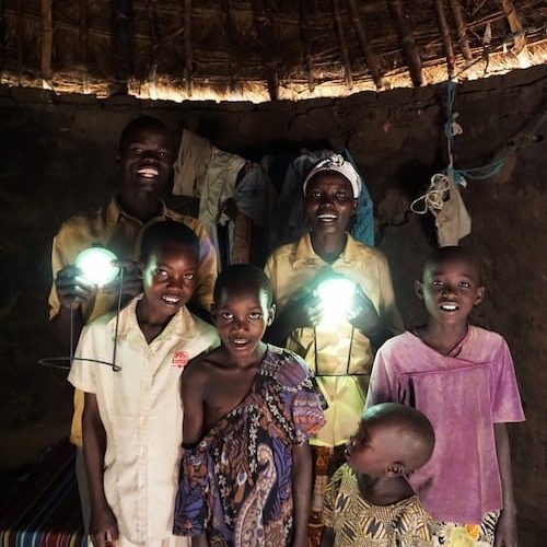 African family with Give solar light products